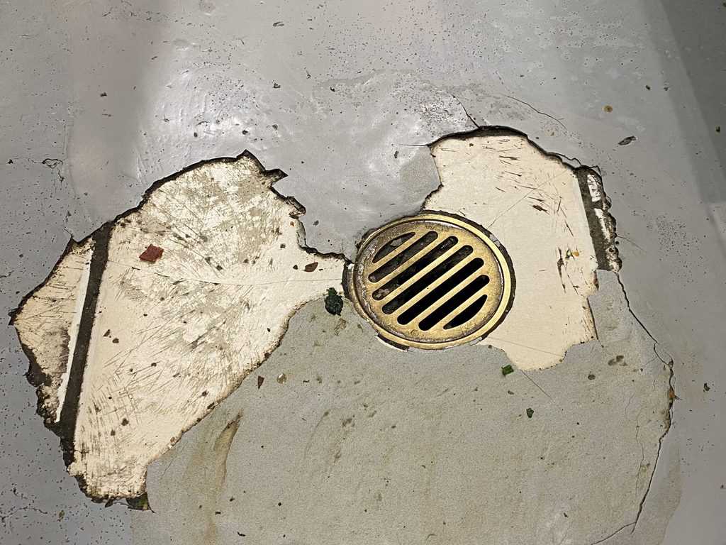 This image highlights an epoxy floor requiring patching