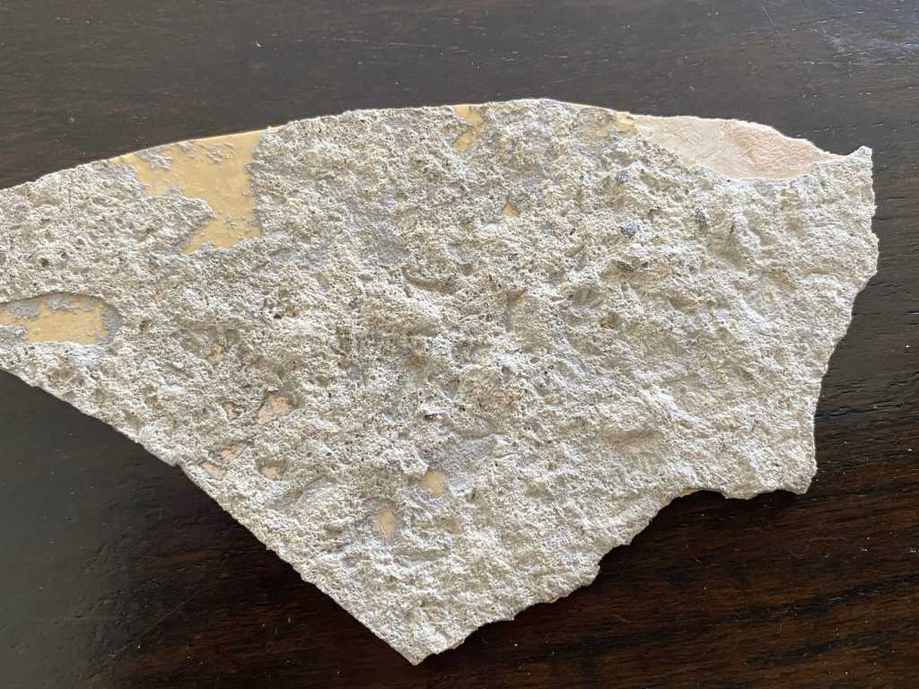To show concrete on the back of epoxy that has flaked off